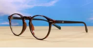Round anti blue light glasses with silver accents, wire-core temples and steel hinges
