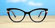 Vintage cat-eye blue blocker glasses in black with purple and gold highlights and gold metal temples