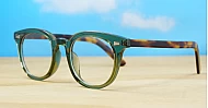 Vintage-style translucent green computer glasses with tortoise temples and wire-core temples