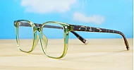 Large translucent green blue blocker glasses with tortoise temples and silver accents