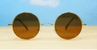Cosmic Lennon style round polarised sunglasses gold frames small face