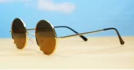 Cosmic Lennon style round polarised sunglasses gold frames small face
