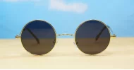 Cosmic Lennon style round polarised sunglasses gold frames small face