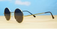 Cosmic Lennon style round polarised sunglasses gold frames small face