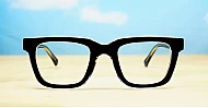 Rectangular blue blocker glasses with black to transparent fade frames and inner core wire temples