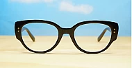 Chunky oval blue blocker glasses with robust steel hinges