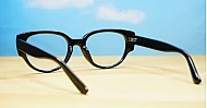 Chunky oval blue blocker glasses with robust steel hinges