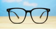 Shiny black square blue block glasses with silver detailing and robust steel hinges
