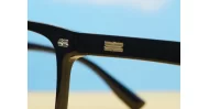 Shiny black square blue block glasses with silver detailing and robust steel hinges