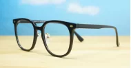 Round shiny black TR90 anti blue light glasses with gold detailing and steel hinges