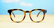 Round medium blue blocker glasses in black or tortoise with inner core wire temples