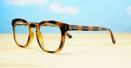 Round medium blue blocker glasses in black or tortoise with inner core wire temples