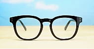 Round medium blue blocker glasses in black or tortoise with inner core wire temples