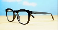 Round medium blue blocker glasses in black or tortoise with inner core wire temples