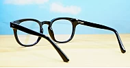 Round medium blue blocker glasses in black or tortoise with inner core wire temples