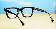 Rectangular blue blocker glasses with black to transparent fade frames and inner core wire temples