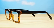 Sleek rectangular blue light glasses with silver detailing and robust steel hinges