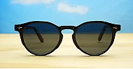 The Acorn small unisex vintage round UV400 sunglasses in shiny black with silver accents and dark lenses
