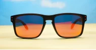 Tama red mirror revo polarised sunglasses curved wrap frame grey base lens