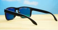 Tama red mirror revo polarised sunglasses curved wrap frame grey base lens