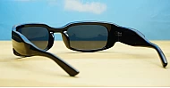 The Dasi male wrap-around UV400 sunglasses in shiny black with dark lenses