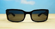 The Dasi male wrap-around UV400 sunglasses in shiny black with dark lenses