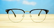 Black and gold clubmaster blue blocker glasses with vintage styling and steel hinges