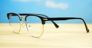 Black and gold clubmaster blue blocker glasses with vintage styling and steel hinges