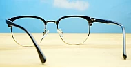 Black and gold clubmaster blue blocker glasses with vintage styling and steel hinges