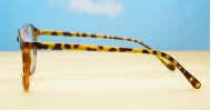 Round tortoise anti blue light glasses with gold accents and steel hinges