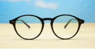 Round black blue block glasses with silver accents and steel hinges