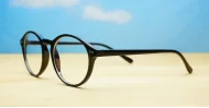 Round black blue block glasses with silver accents and steel hinges