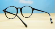 Round black blue block glasses with silver accents and steel hinges