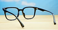 Square black anti blue light glasses with silver details and silver pins on the temples
