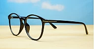 Black computer glasses with gold accents and blue light lenses
