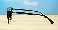 Black computer glasses with gold accents and blue light lenses