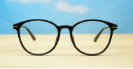 Black computer glasses with gold accents and blue light lenses