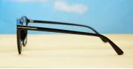 Black computer glasses with gold accents and blue light lenses