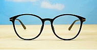 Black computer glasses with gold accents and blue light lenses