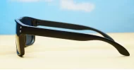 Tama Black curved wrap polarised sunglasses silver detail dark grey lenses