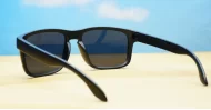Tama Black curved wrap polarised sunglasses silver detail dark grey lenses