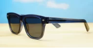 The Spike unisex vintage wayfarer UV400 sunglasses in translucent blue with black sides, gold pips and dark grey lenses