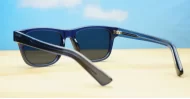 The Spike unisex vintage wayfarer UV400 sunglasses in translucent blue with black sides, gold pips and dark grey lenses