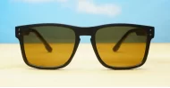The Comet sporty black UV400 sunglasses for men with Oakley-inspired wrap frames and brown Category 3 lenses