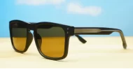 The Comet sporty black UV400 sunglasses for men with Oakley-inspired wrap frames and brown Category 3 lenses