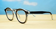 Round black and clear two-tone computer glasses with silver pin temple detailing