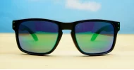 Tama Aqua blue mirror revo polarised sunglasses matte black curved wrap frame