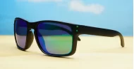 Tama Aqua blue mirror revo polarised sunglasses matte black curved wrap frame