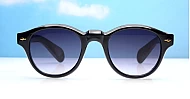 The Gigi round vintage UV400 sunglasses in black with gold arrow detailing and gradient dark grey lenses