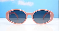 The Freya medium retro oval UV400 sunglasses in translucent or solid colours with super dark lenses
